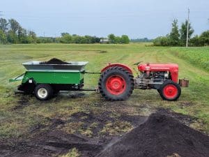 320 spreader pulled by a tractor