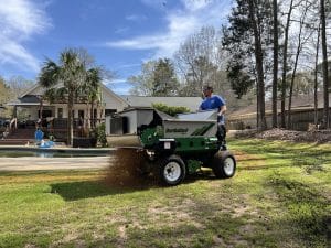 the 415SP topdresser in action on a lawn