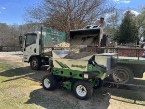 415SP being loaded for a topdressing job