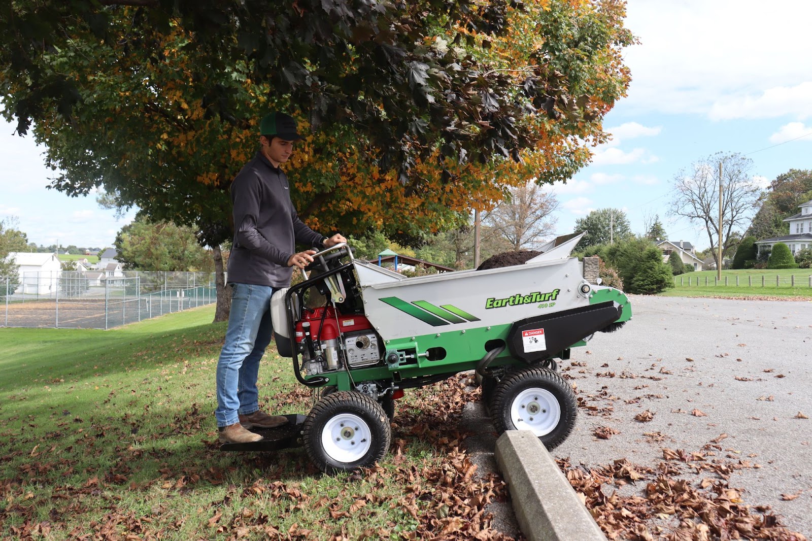 410 Topdresser self propelled over a curb