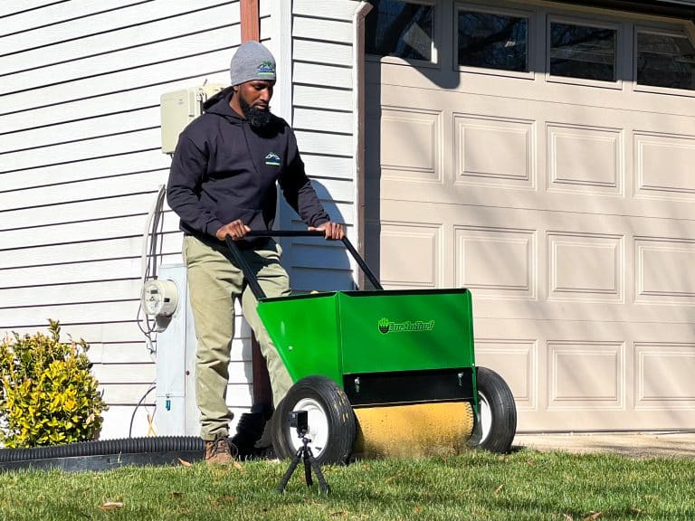 lawn drop spreader in action