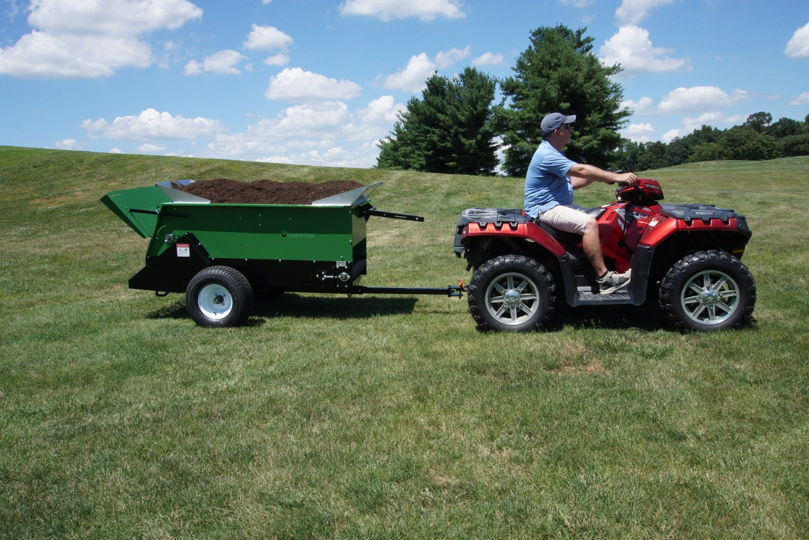 220MS being pulled behind a tractor